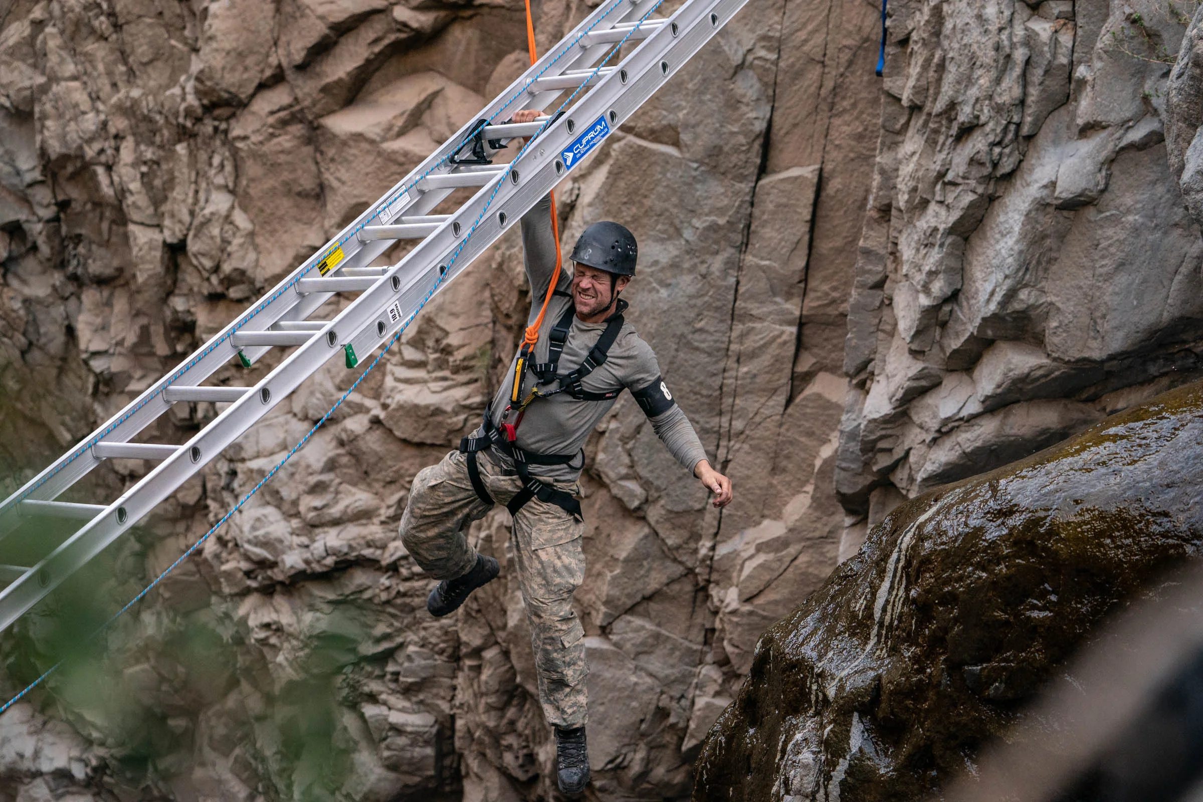 Wayne Bridge grits his teeth, holding on with one hand whilst crossing the Devils Throat Episode 4 Minnow Films / Channel 4