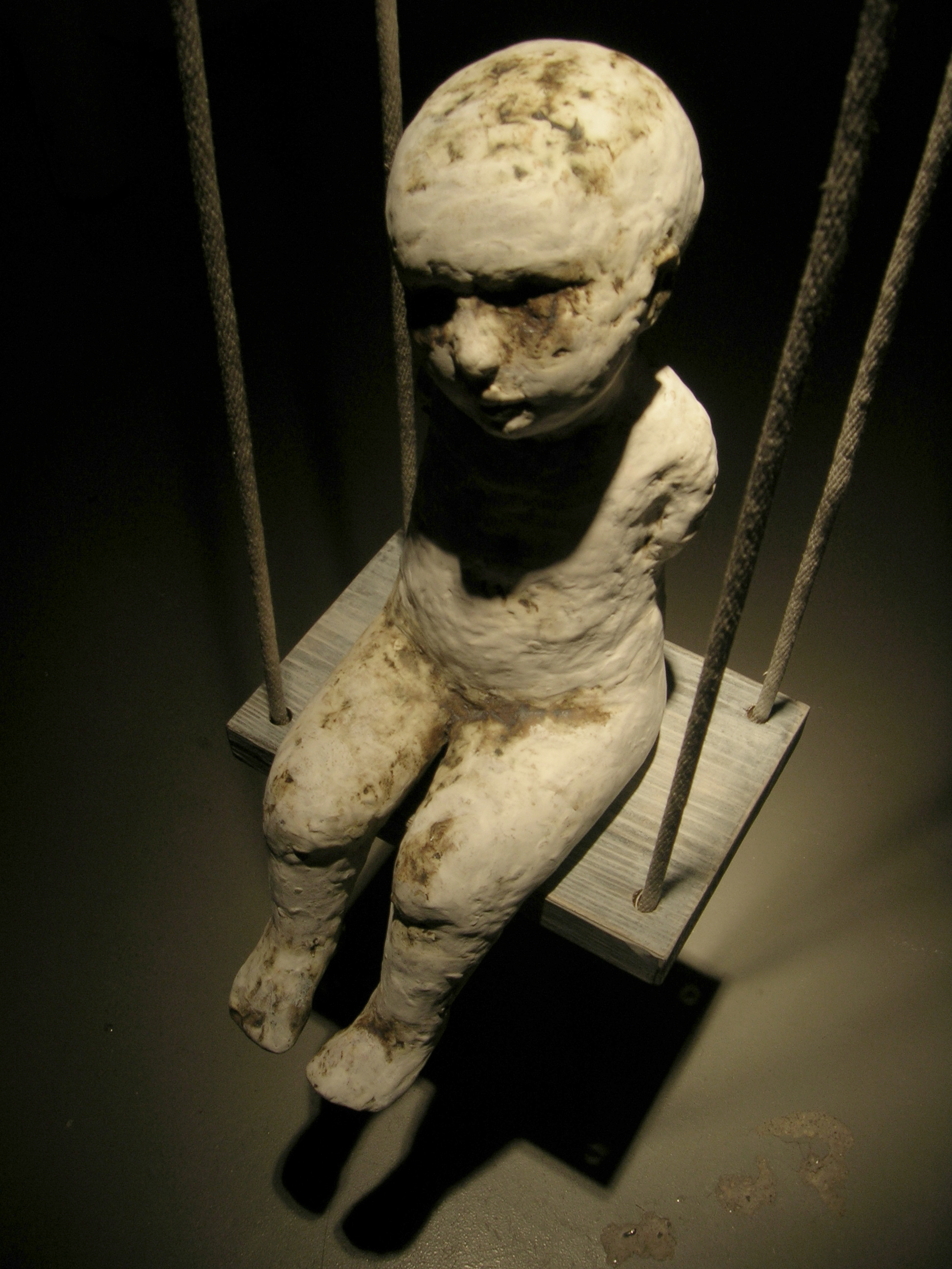 Falling Rope of Silence, 2005, Ceramic, rope, and wood.
