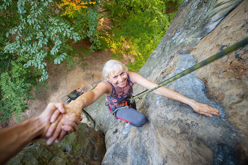 older-woman-rock-climbing-adventure-travel.jpg