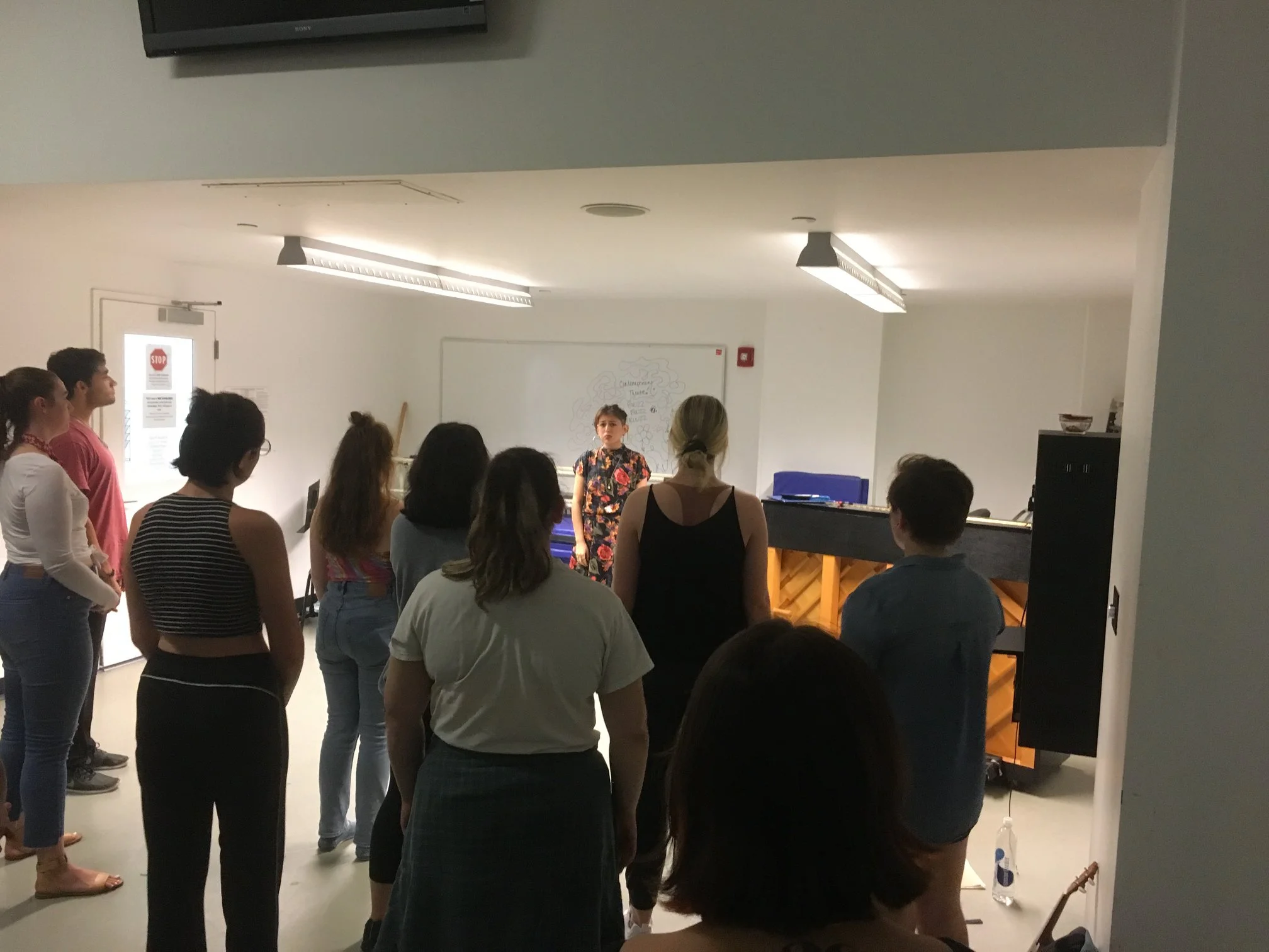 Group vocal rehearsal with ensemble. Photo by Theresa Lang.