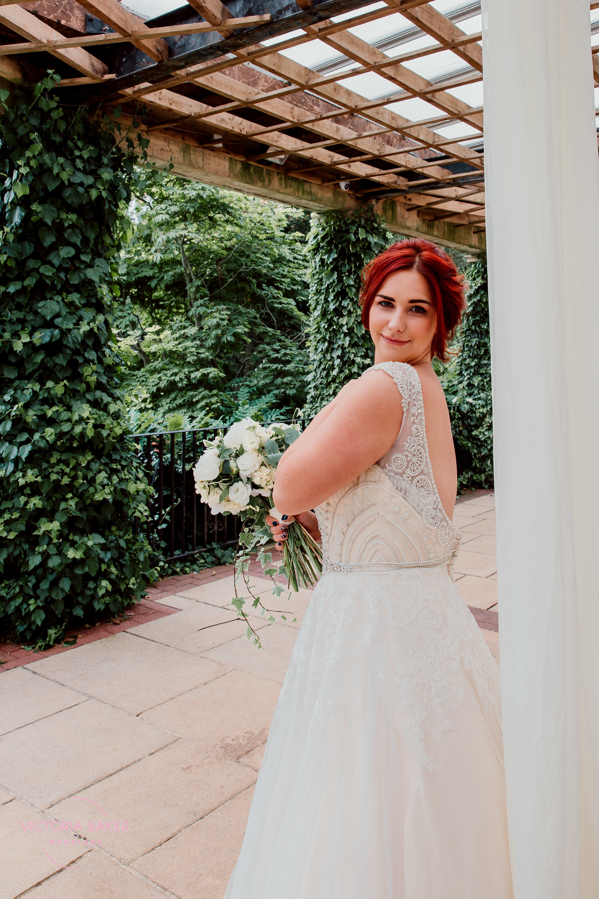 VICTORIABAKERWEDDINGS smiley over shoulder.jpg