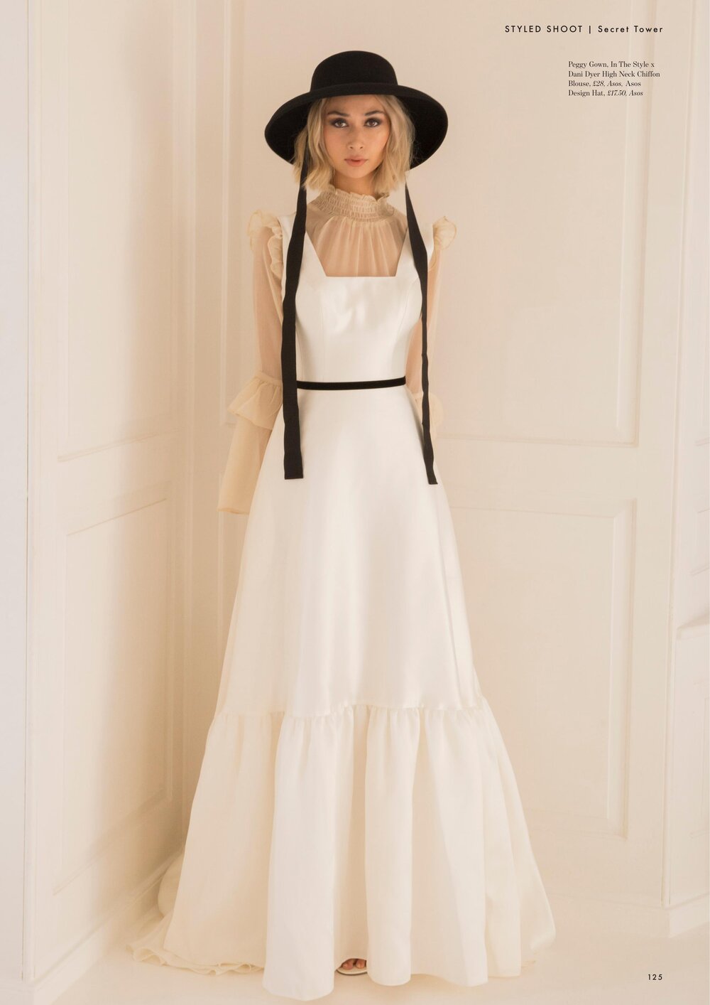 Belle Bridal Secret Tower - Long shot with black hat.jpg