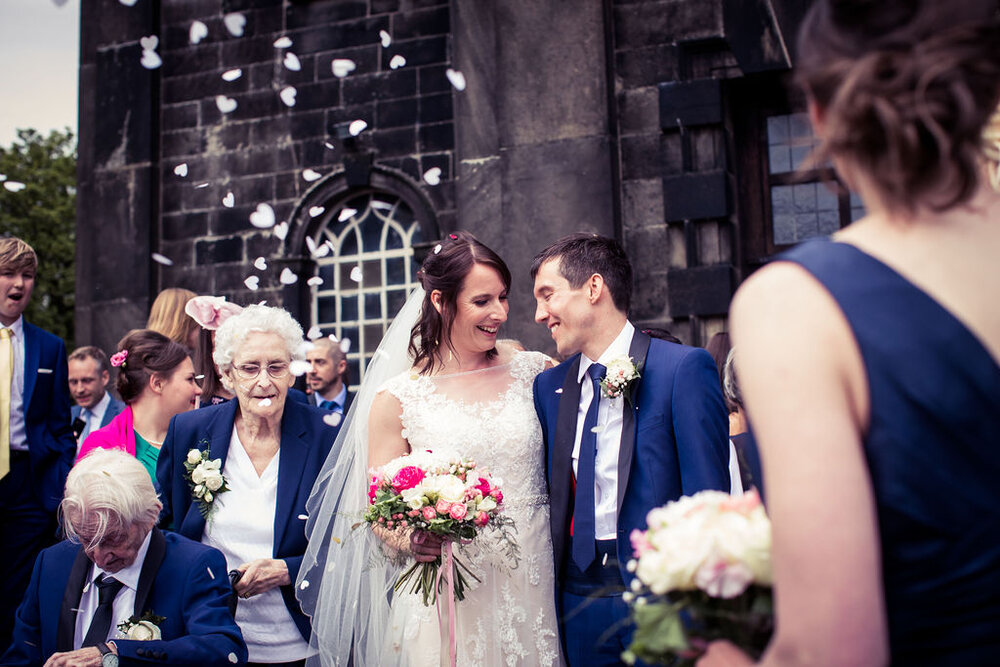 NicolaJulianWedding couple w confetti.jpg