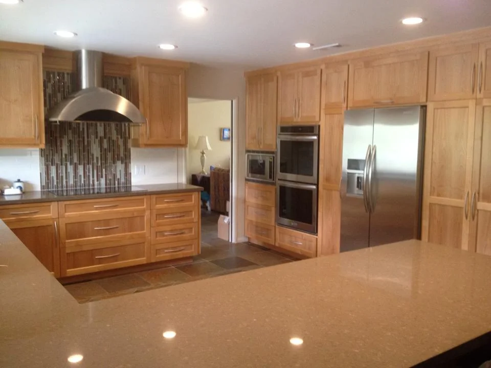 Orange County Kitchen Remodel with natural wood cabinets, convection oven, high end refrigerator and custom oven hood