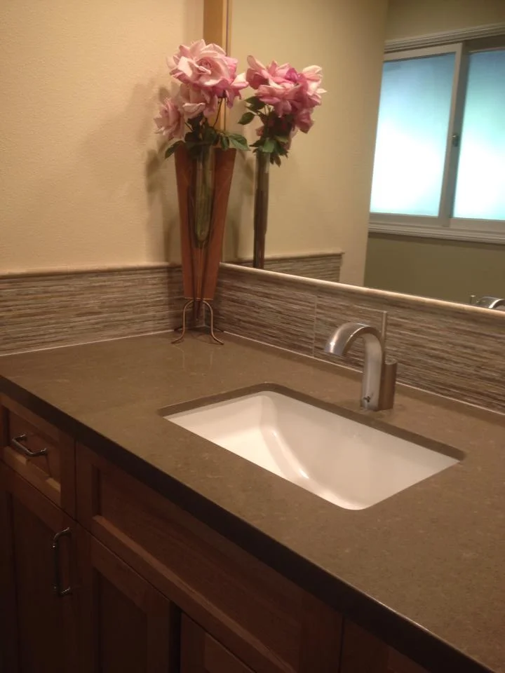 wink with luxury bathroom fixtures and pink flowers in orange county remodel