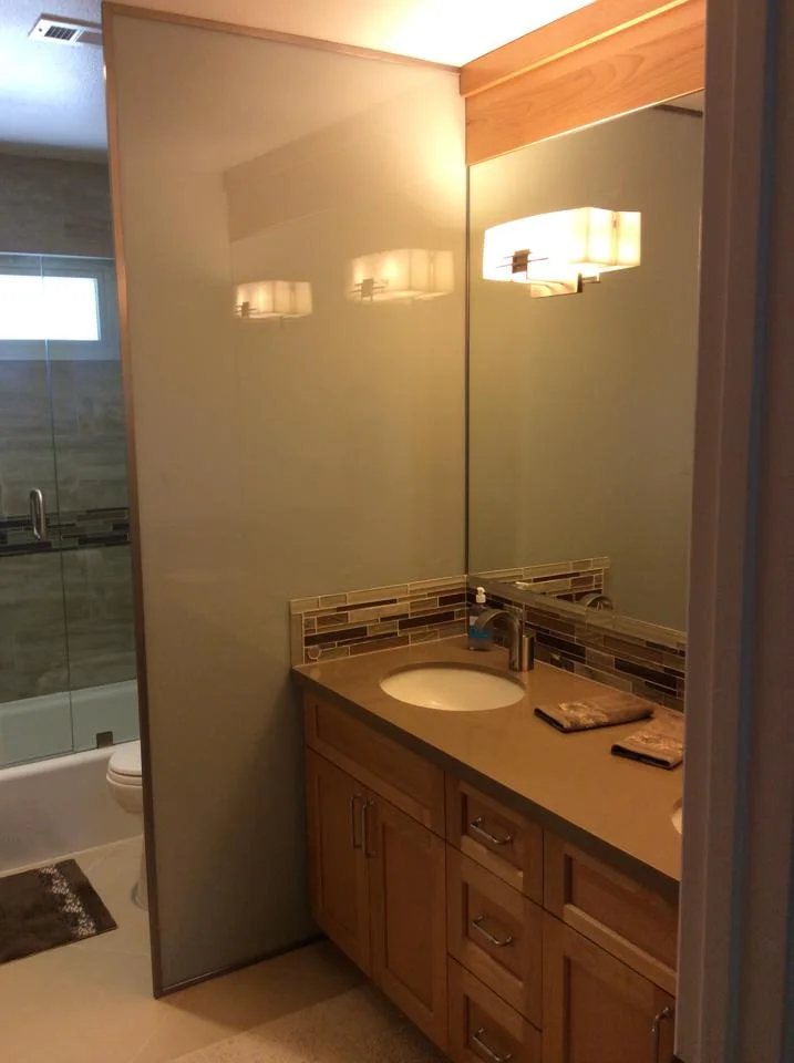 Orange County Remodel - Dual Sink Vanity with in-mirror light and custom wood cabinets