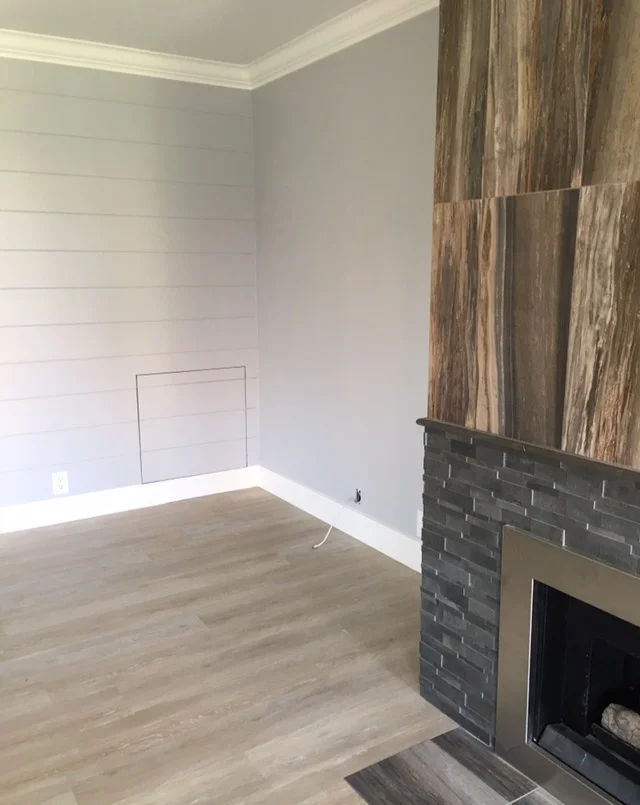 Designer Fireplace and natural wood floors