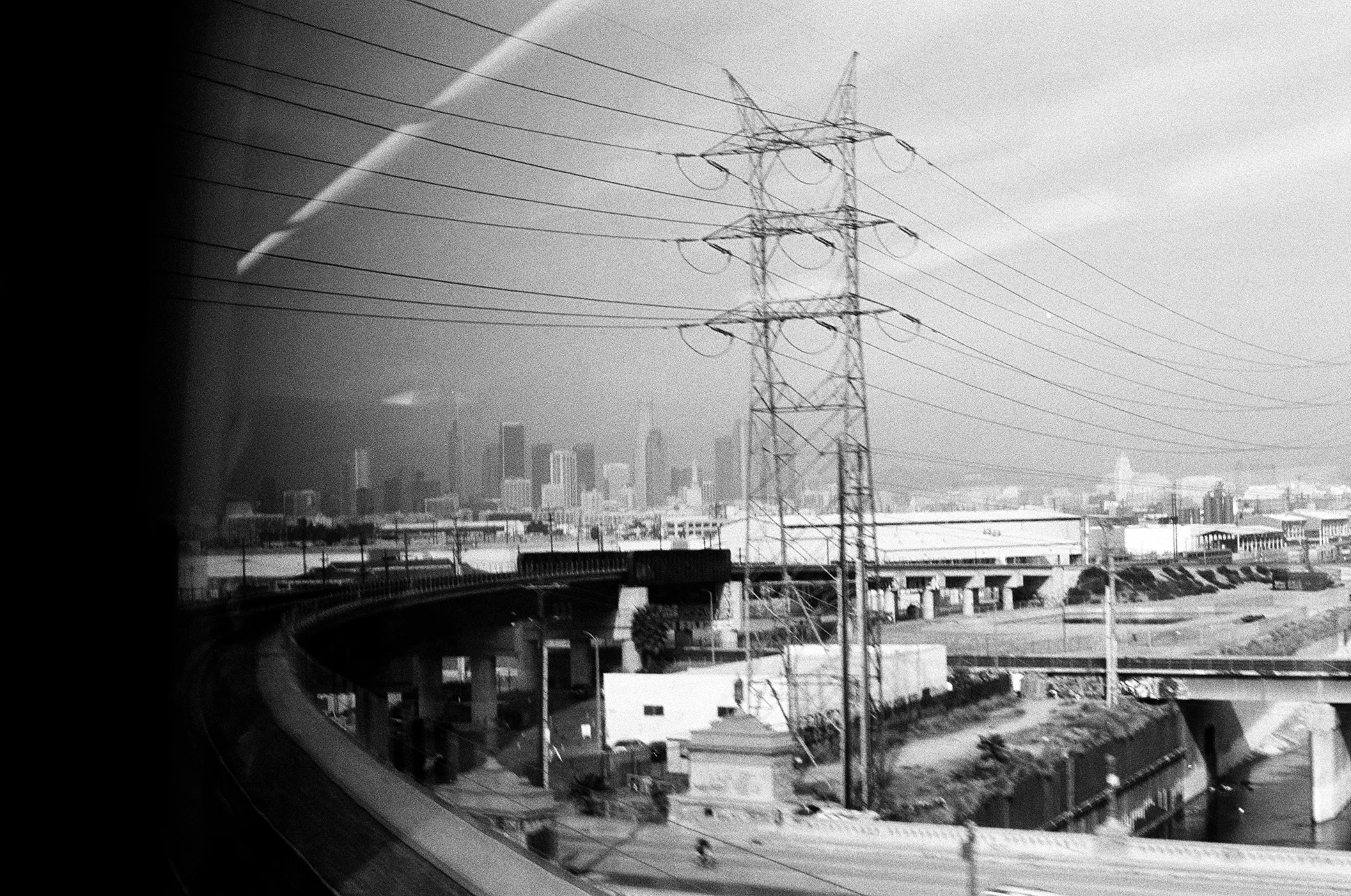 Downtown off in the distance as we approach Union Station. Pentax K1000. Kodak Tri-X 400. Fletcher Berryman 2018.