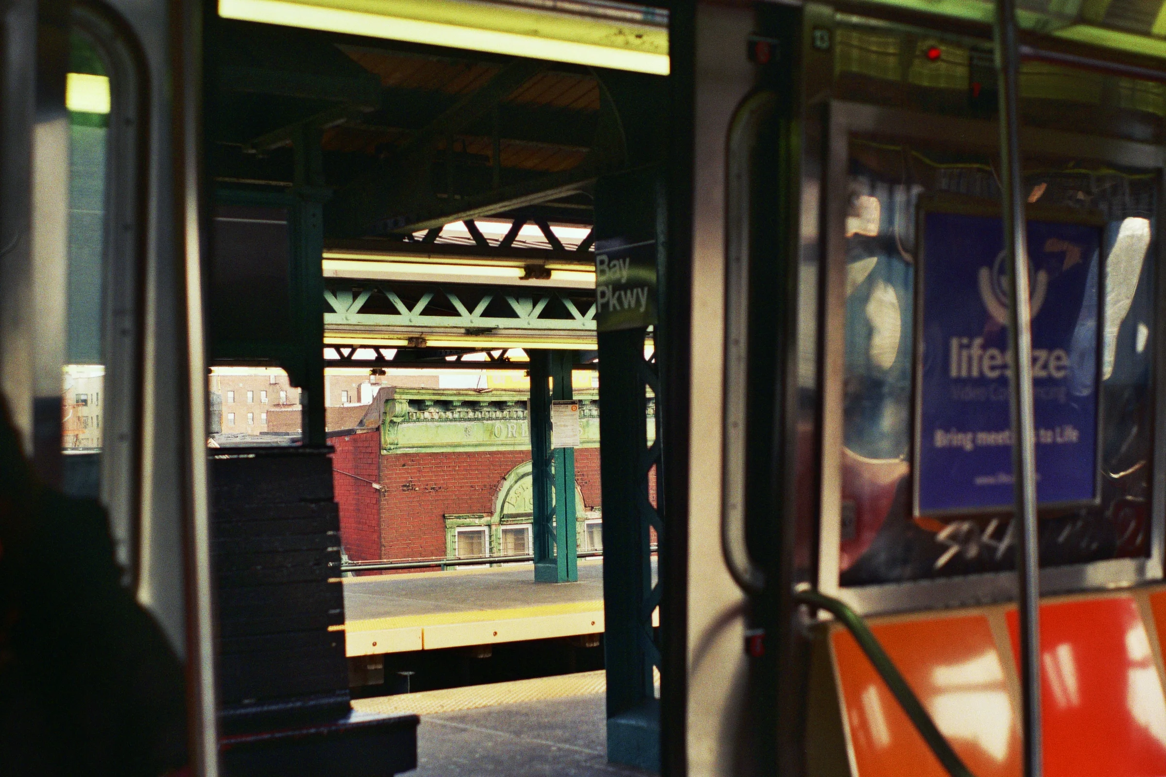 Peeking out the train doors at Bay Parkway. South Brooklyn, New York. Kodak Ultra Max 400. Pentax K1000. Fletcher Berryman 2019.