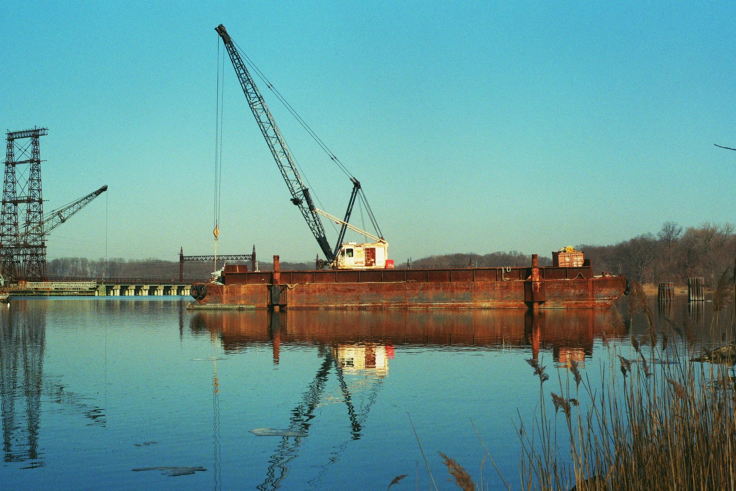 One of several rusted, abandoned ships in the Hutchinson River. The Bronx. Kodak Ultra Max 400. Pentax K1000. Fletcher Berryman 2019.