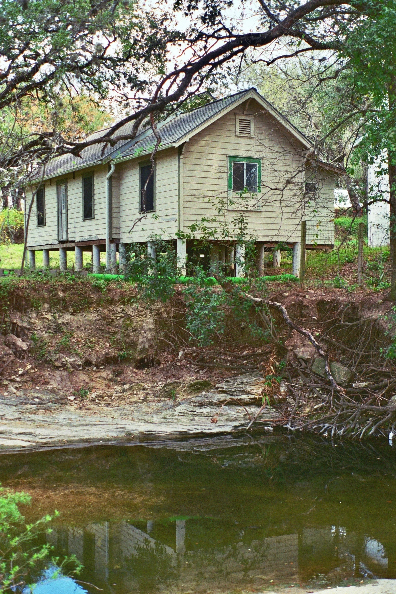 A home stands proudly above Bouldin Creek. Austin, TX. Kodak Ultra Max 400. Pentax K1000. Fletcher Berryman 2019.