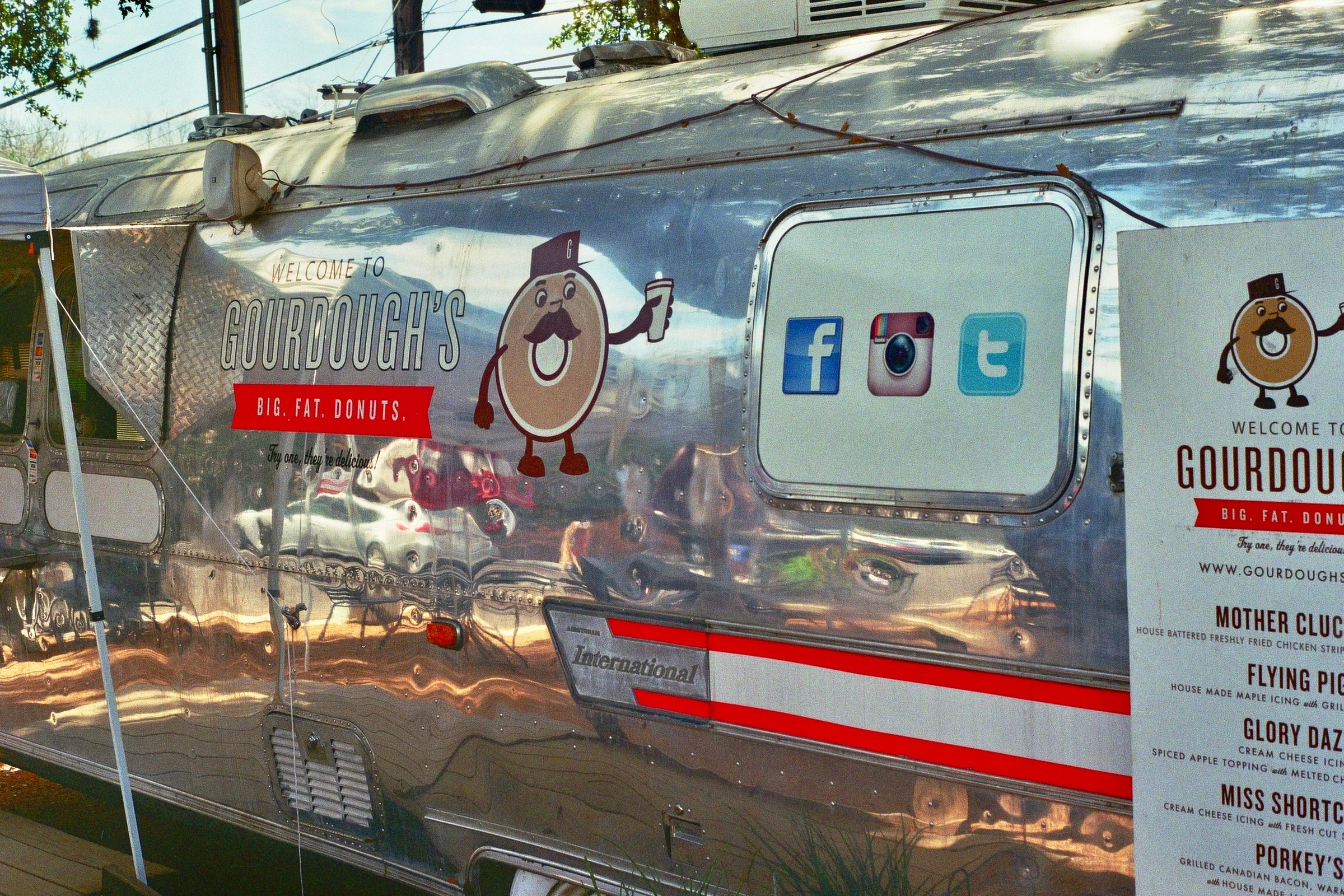 Big Fat Donuts, a donut-serving Airstream with donuts lathered in everything from bacon to strawberry jam to fried chicken. Austin, TX Kodak Ultra Max 400. Pentax K1000. Fletcher Berryman 2019.