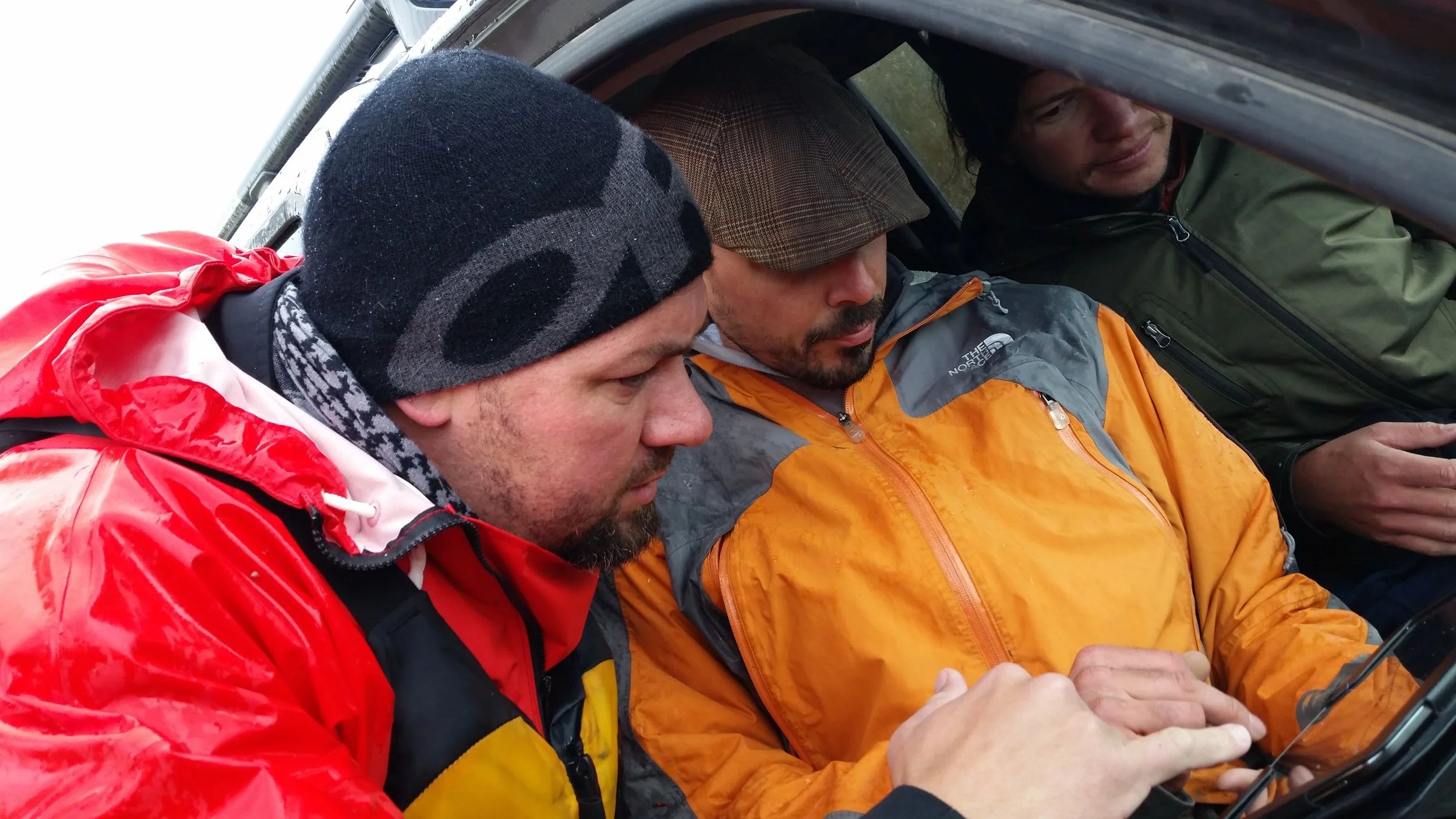  John, Jay and Lincoln consult a map as they search for Fenn’s gold. [Photo: Damien Willis]   