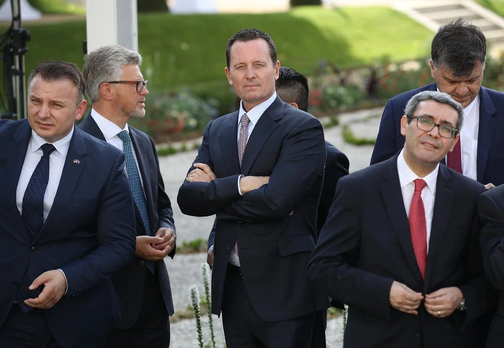 Richard Grenell, center, the American ambassador to Germany, has been an outspoken advocate for the Trump administration since taking his post in Berlin in May. [Photo: Sean Gallup/Getty Images]