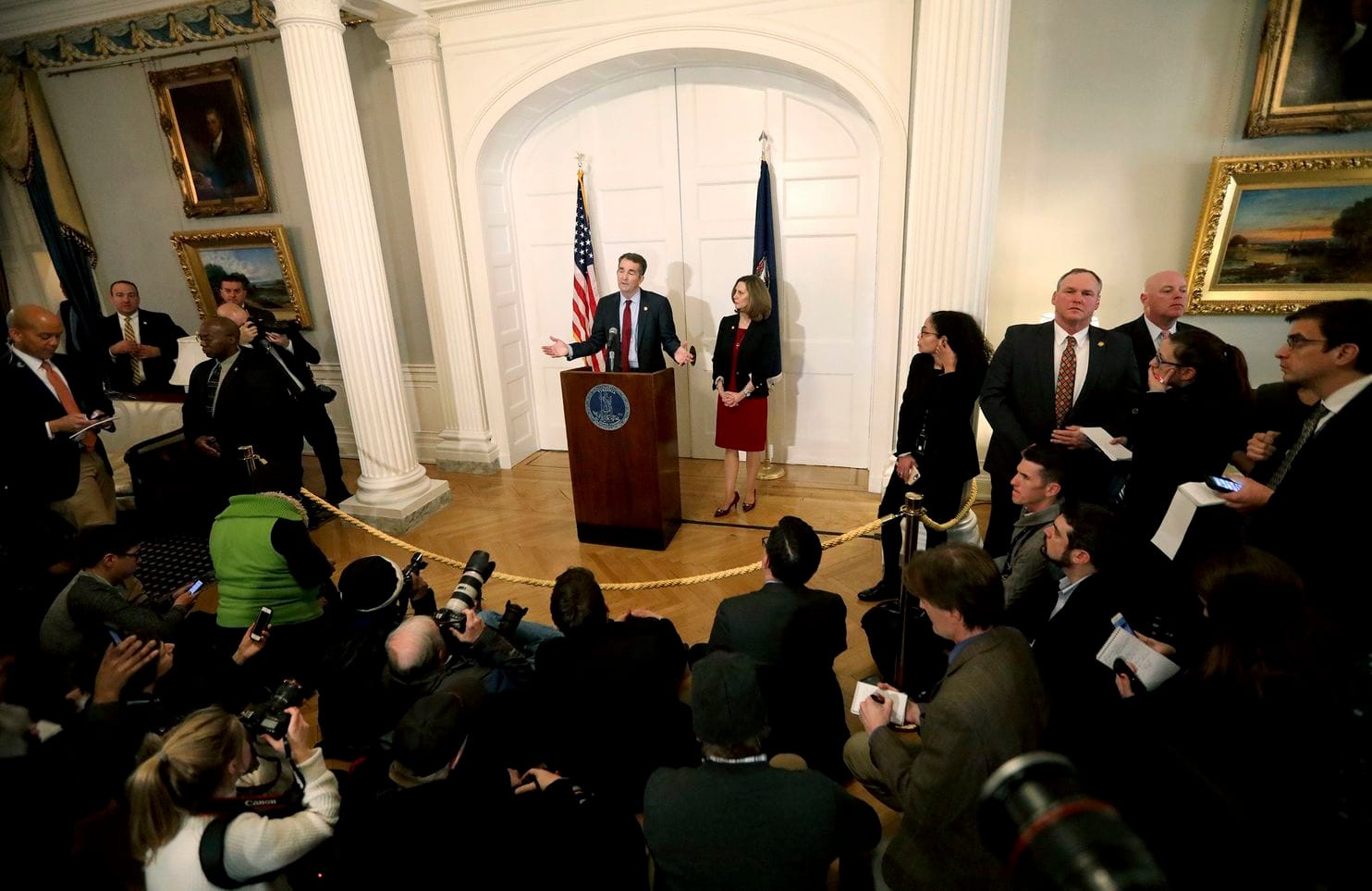 Virginia Gov. Ralph Northam, with his wife, Pam, at his side, speaks at a news conference in Richmond, Va., on Feb. 2. [Steve Earley/The Virginian-Pilot via AP]
