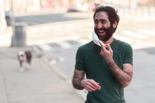 Las Cruces native Amer Jandali puts on a face mask while standing on the empty sidewalks of Brooklyn, New York, during the COVID-19 pandemic on May 3, 2020. Jandali recently began selling cotton masks at www.futuremeetspresent.com; he donates 50 per…