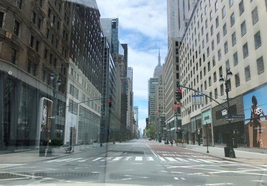 Fifth Avenue in Manhattan is empty on Sunday, May 24, 2020. Ordinarily, it would be bustling on Memorial Day Weekend, but the city is under a stay-at-home order to mitigate the spread of COVID-19. [Courtesy Photo / Amer Jandali]