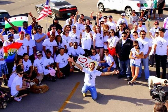 Amer Jandali poses at Mesilla Valley Mall with participants of the Freedom Walk he organized in 2013. The march was designed to raise awareness about human rights violations under the Bashar al-Assad regime. [Damien Willis / Las Cruces Sun-News]