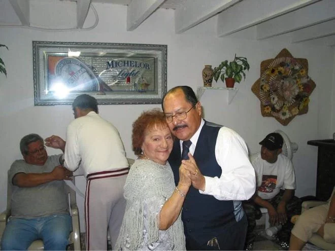 Sergio Vasquez, right, dances with his mother, Pilar, at a family gathering in this undated photo. [Courtesy Photo / Gabe Vasquez]