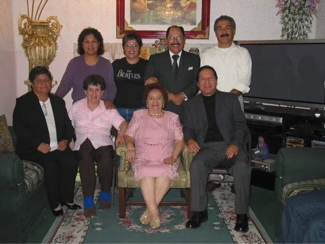 Sergio Vasquez (back row, second from right) poses with relatives at a family gathering in this undated family photo. [Courtesy Photo / Gabe Vasquez]