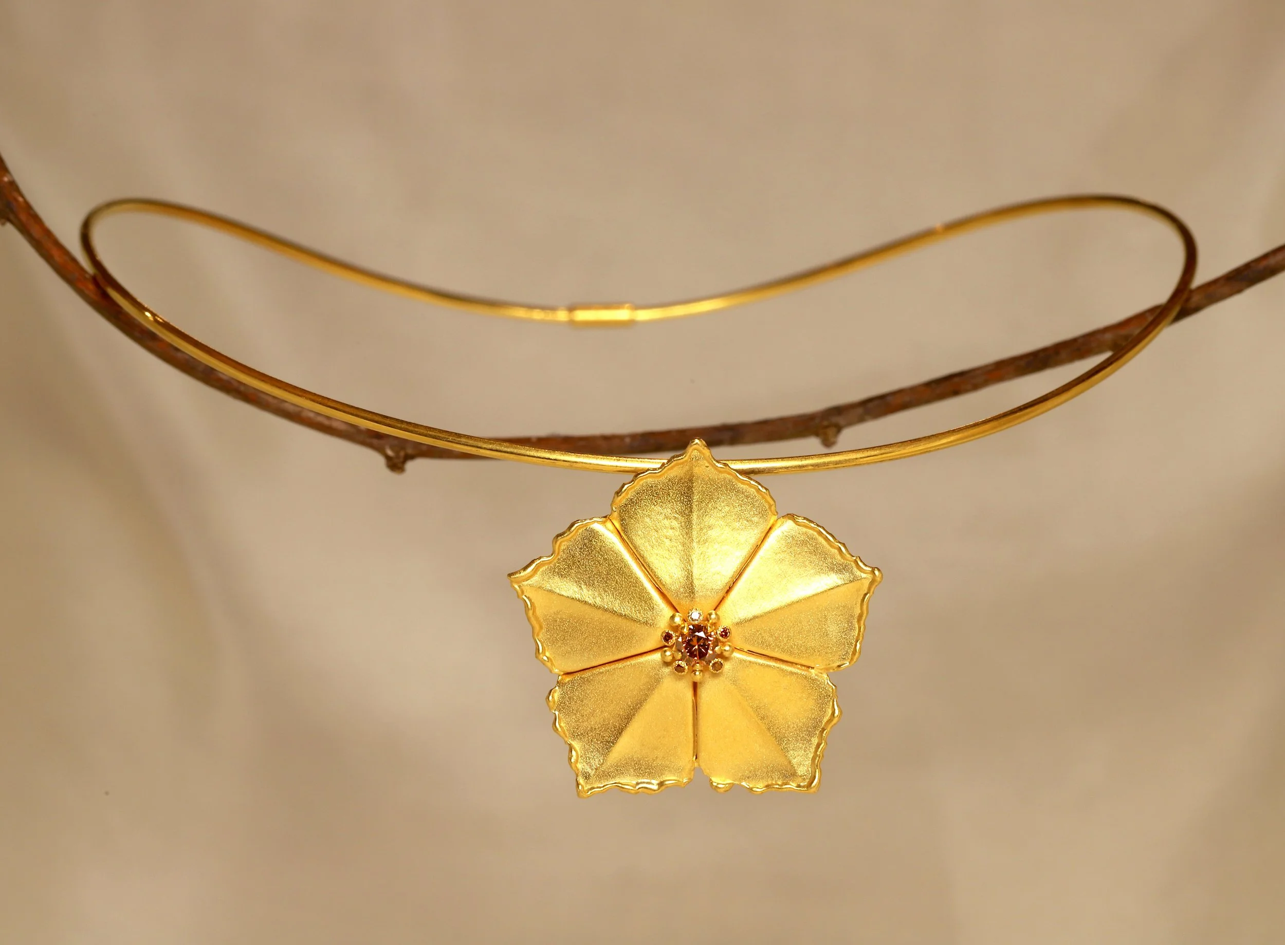 brown diamond med starflower necklace.jpg