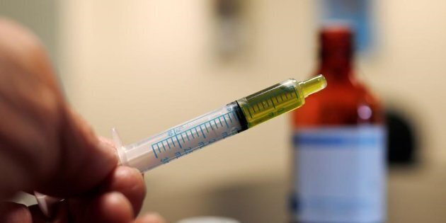 AP VIA THE CANADIAN PRESS A syringe loaded with a dose of CBD oil is shown in a research laboratory at Colorado State University in Fort Collins, Colo., on Nov. 6, 2017.