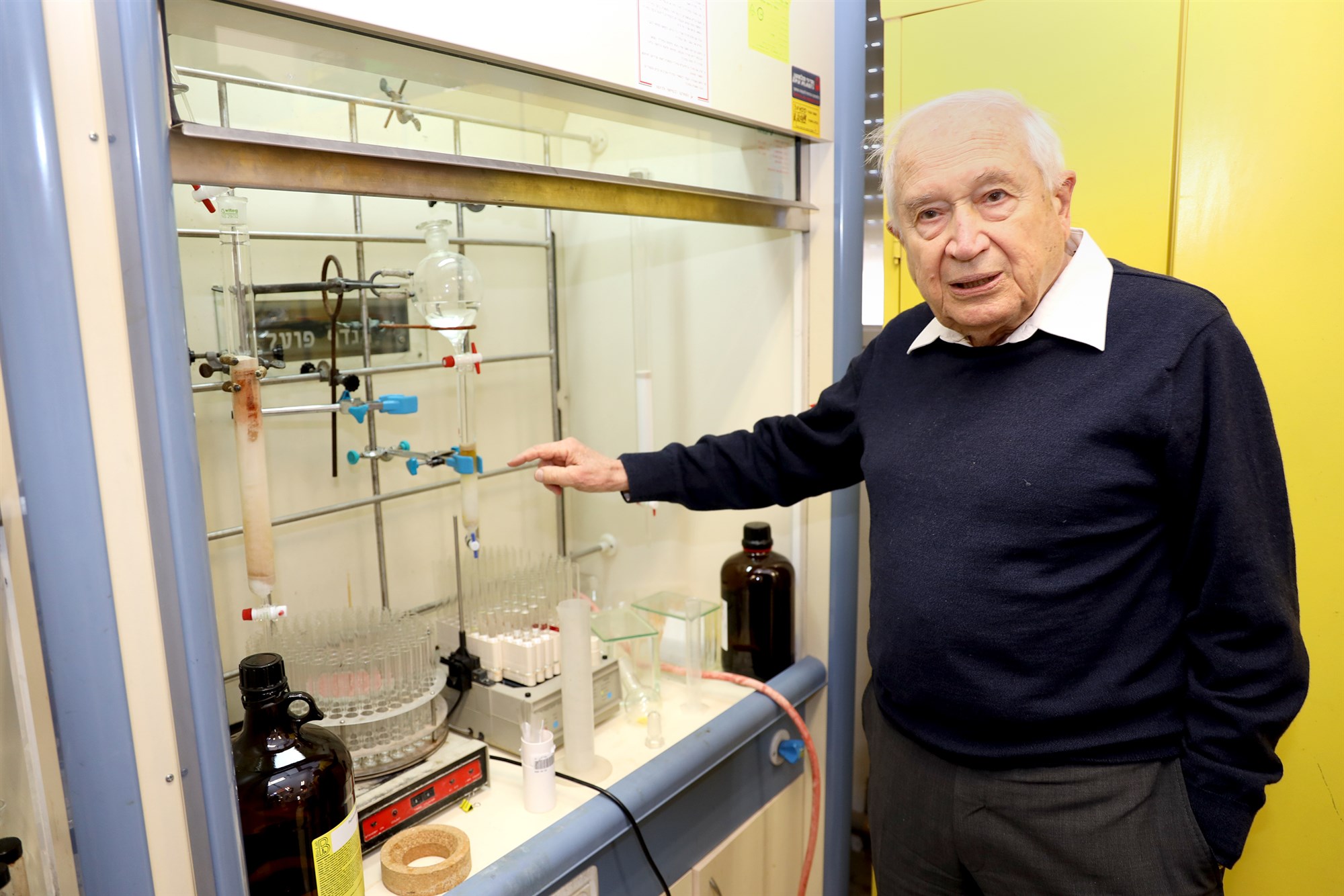 Raphael Mechoulam explaining steps of the process at his Hebrew University lab in Israel.Daniel Fine / EPM