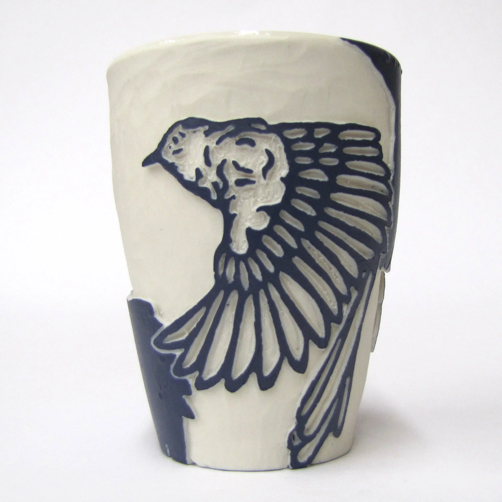 Sgraffito bird flying