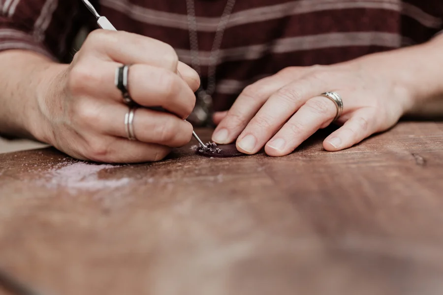 This is me, carving a wax model for a custom design collaboration.