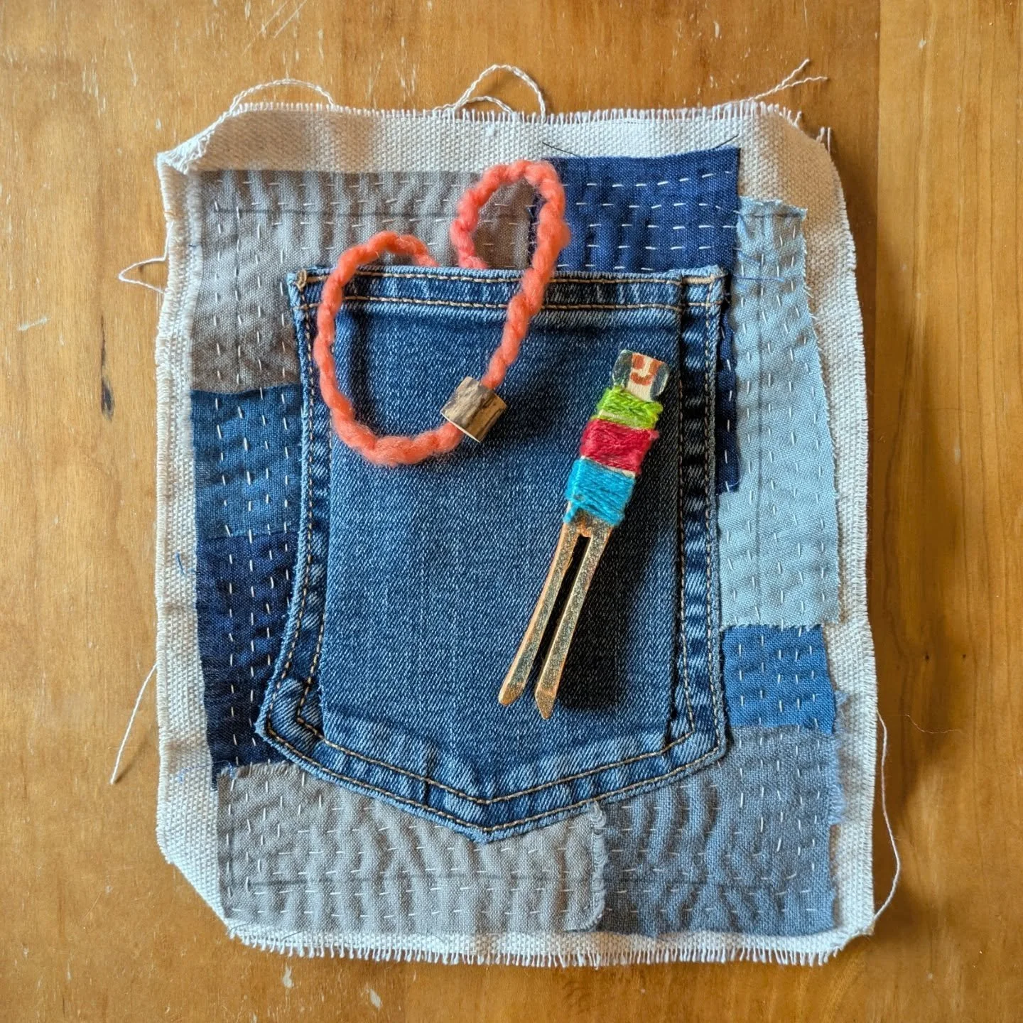 Day 25, Page 5. Treasures from my younger child, from when he was little. Held safe in a pocket, as is the way so many treasures are collected. 
.
He made this worry doll at school, I think. The elderberry bead is from a camping trip he and I went on