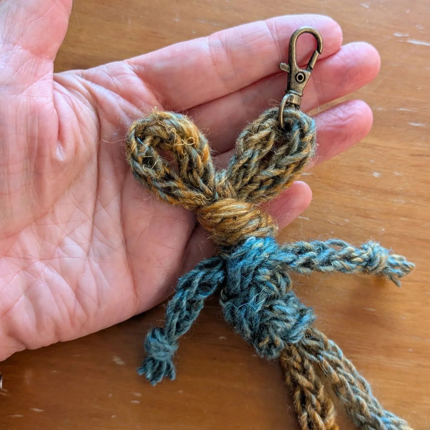 The bunny ... Multiplied! 
I used up the rest of my knitted cord, adding a clasp thingy to make them into charms. Adorbs!
