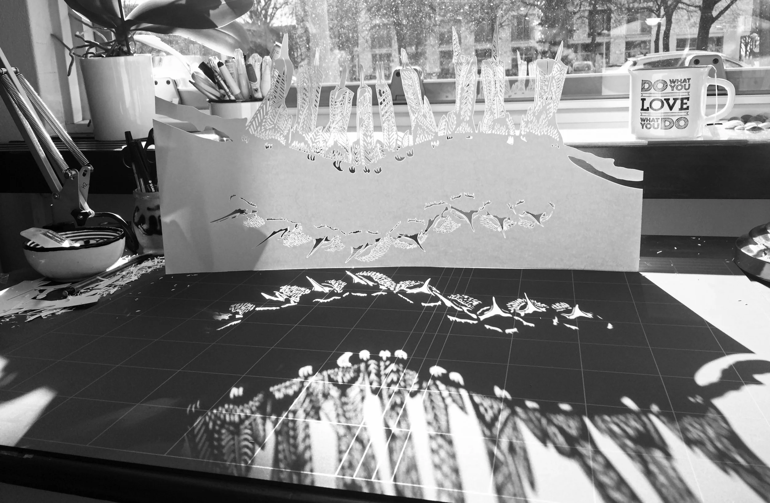 The sunlight shining through the papercuts in Thysart's Amsterdam studio