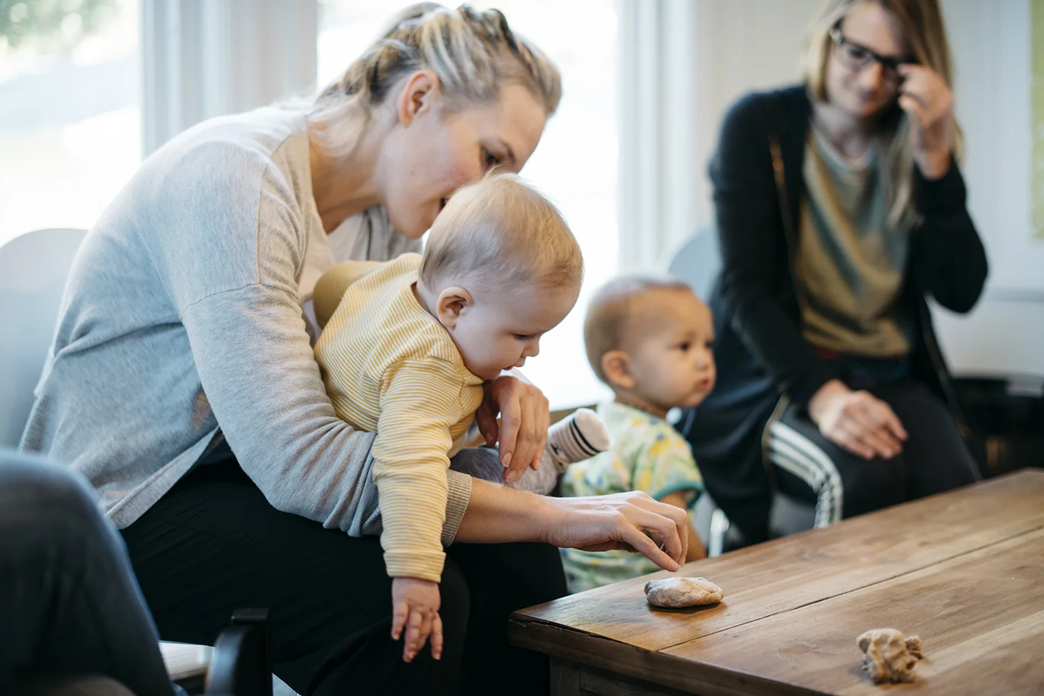 mother and baby shaping bread dough.jpg