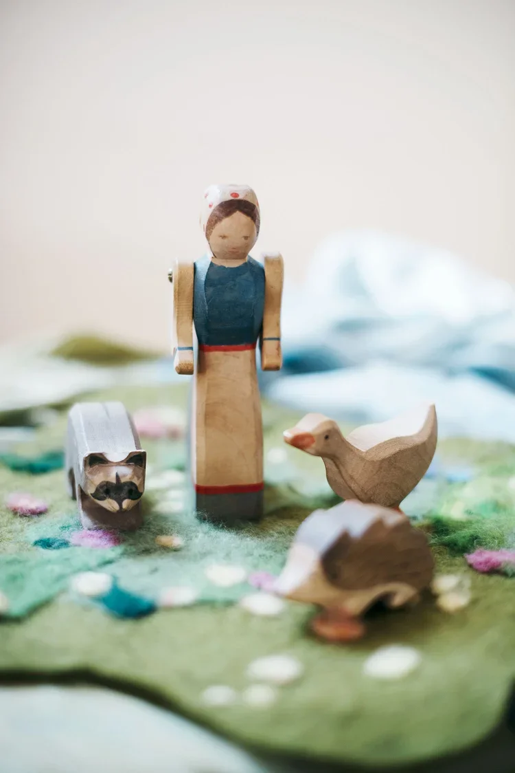 wooden+doll+with+animals (1).webp