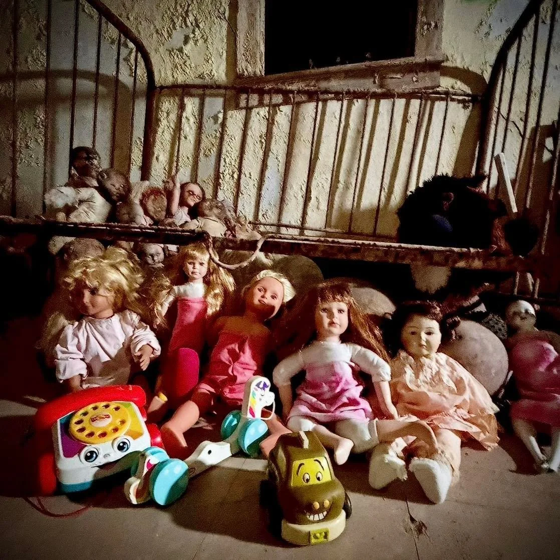 Over the years, visitors have quietly left behind toys, dolls, and stuffed animals. Not as decorations, but as offerings. Gifts for the children many believe never truly left these halls. Some say these objects are moved. Some say they respond. Other