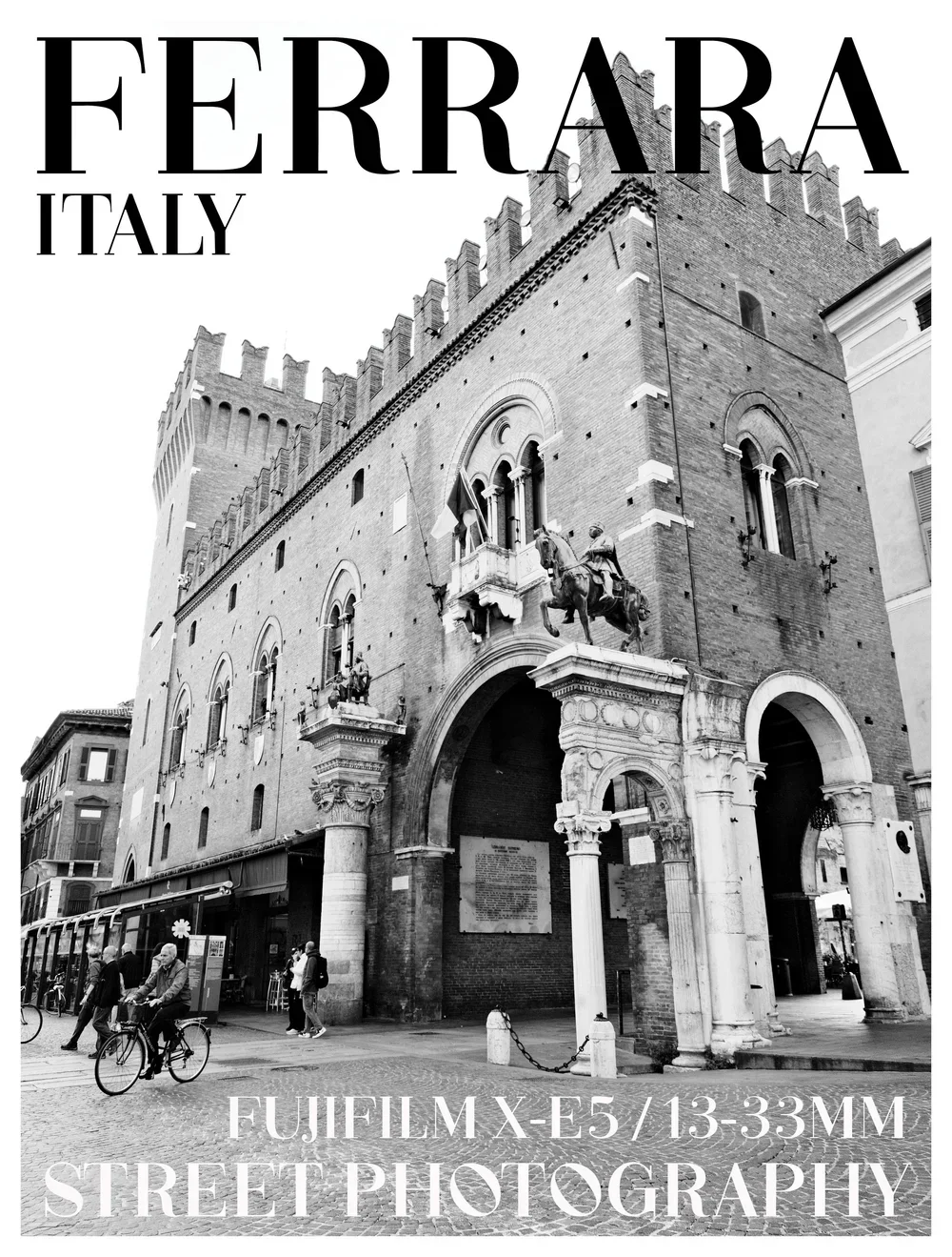 A black and white street scene in Italy with a historic brick building featuring arched windows and statues. There are people walking and biking.