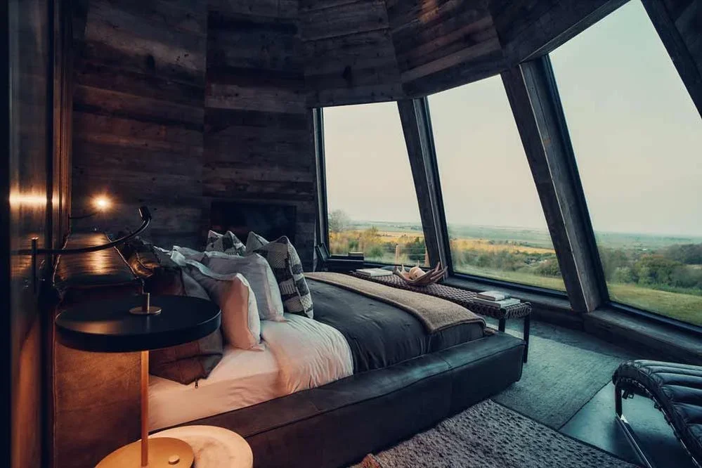 Luxury hotel interior bedroom suite with panoramic windows — architecture & hospitality photography by Simon Songhurst