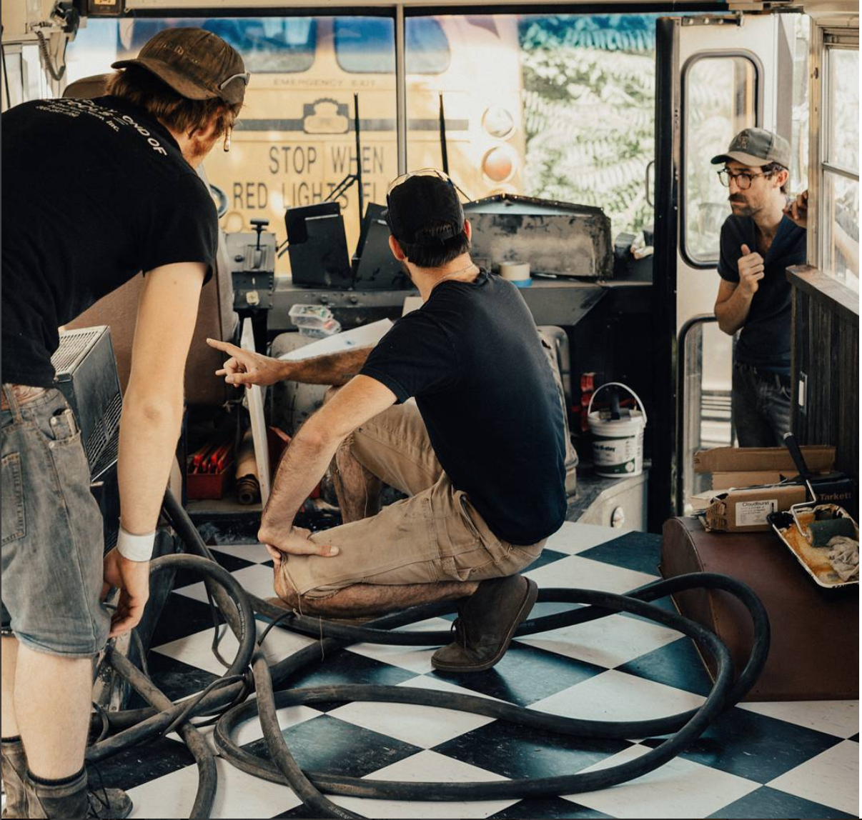 Ben, Charles, and Ty discussing plans on removing the passenger heaters