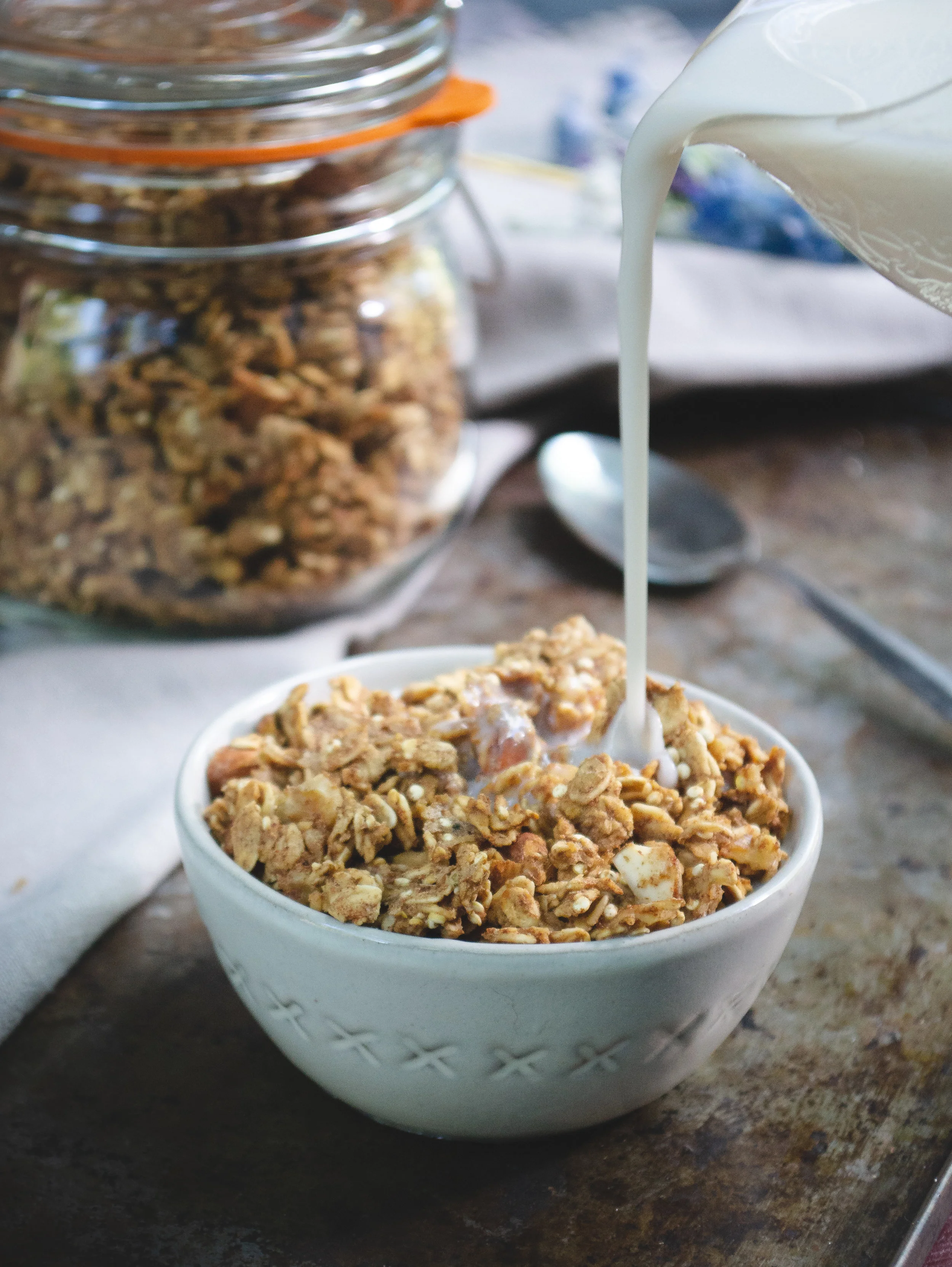Homemade Cashew Milk Recipe | PICTURED: Granola and homemade cashew milk. © Elena Hollenhorst
