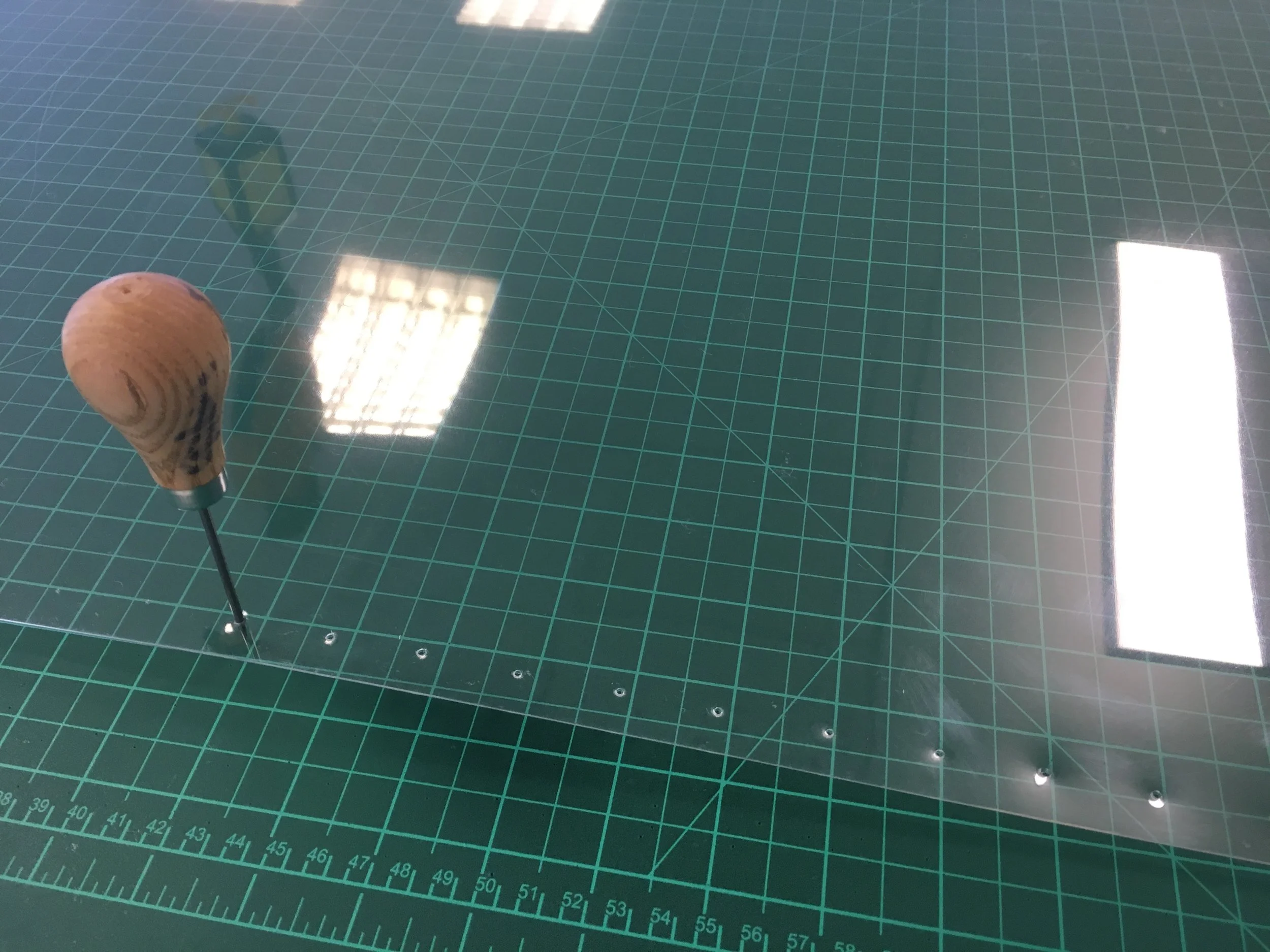  Process:  Preparing perspex sheets for stiching 