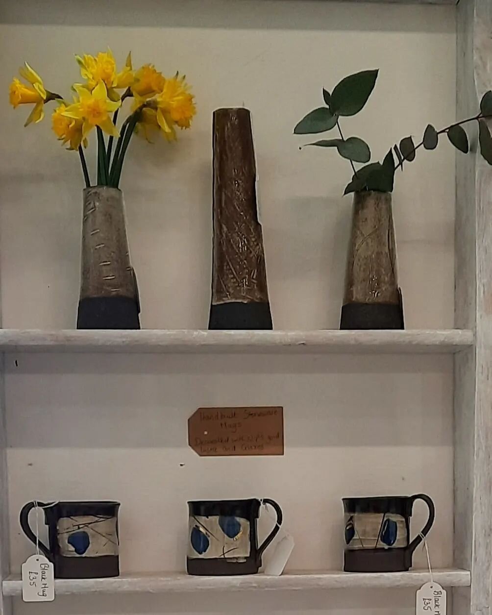 Black clay mugs and vases on the new shelves in the shop.

Each mug is made individually and has little gold lustre accents.
.
.
.
#mugs #vases #designer #pottery #shelfie #contemporaryart #interiors #handmade #style #vicky #ceramics #visit #shopopen