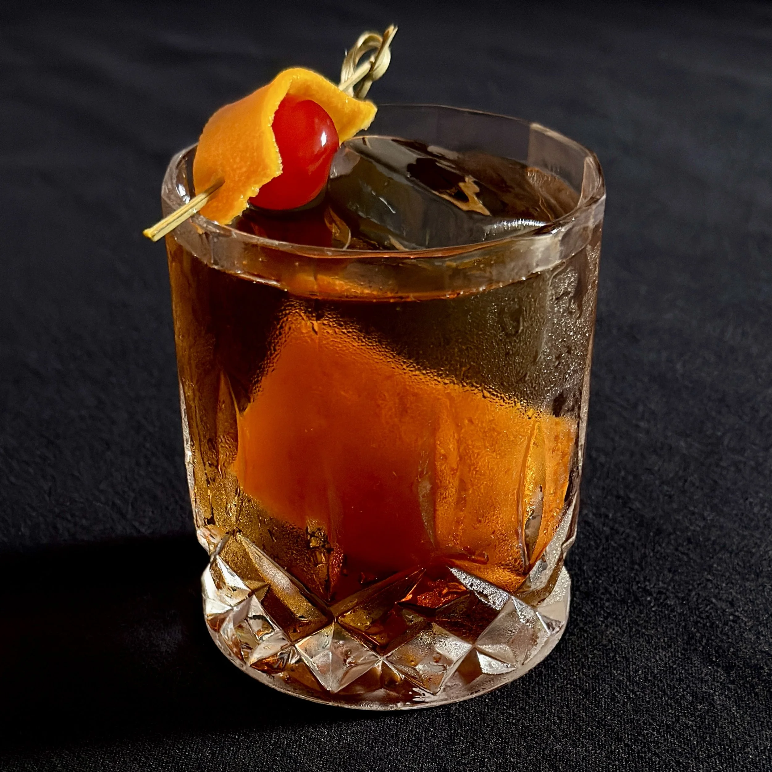 A glass containing an old fashioned. A popular black bear bistro cocktail.