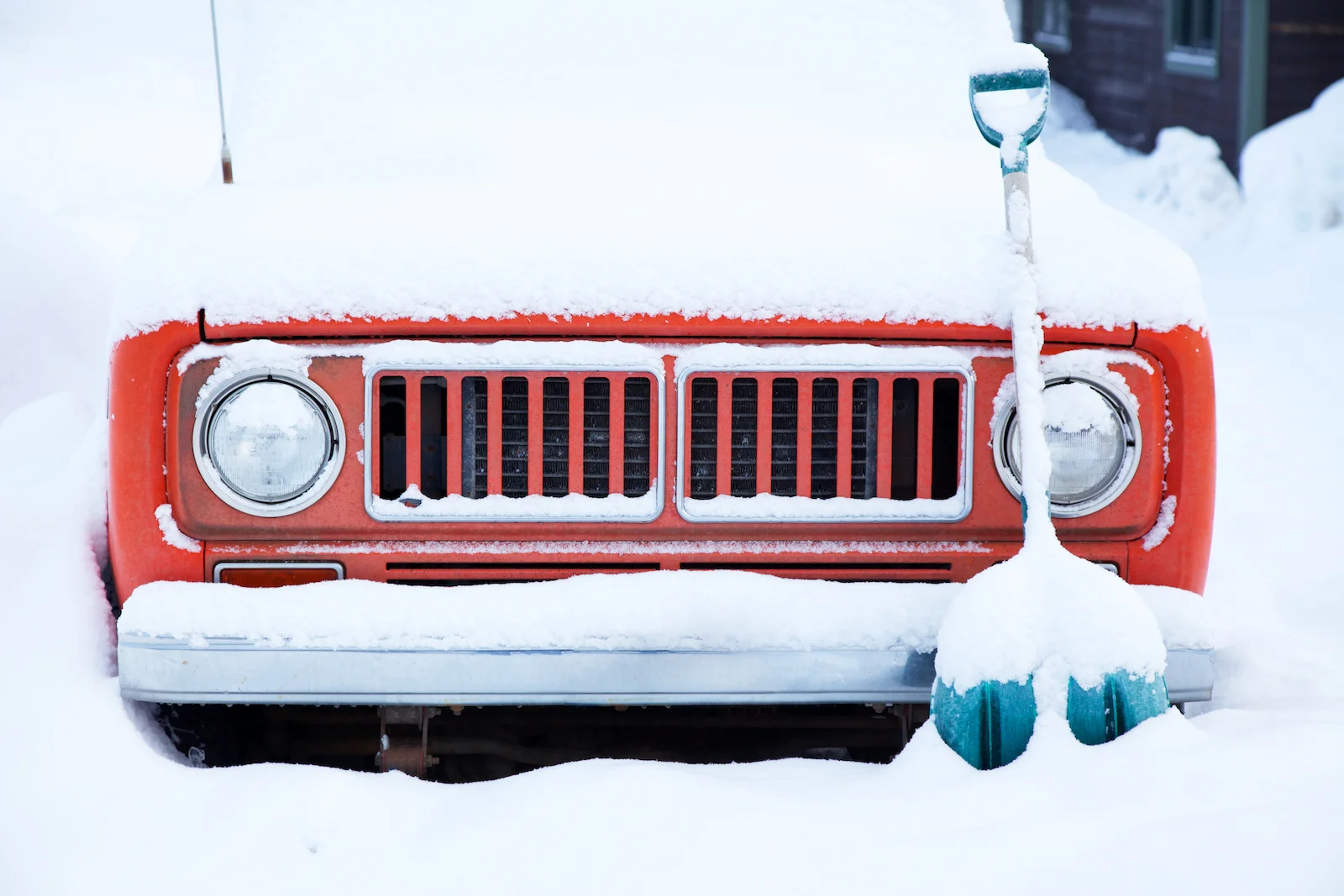 Old Jeep Under Heavy Snowfall.jpg