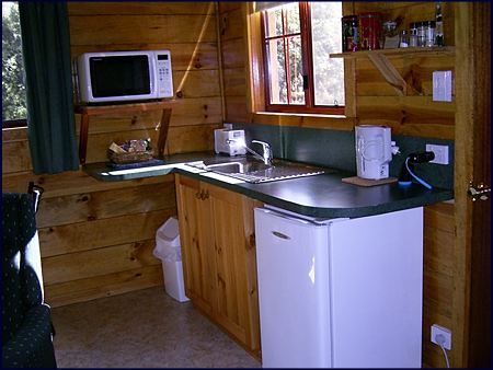  This one bedroom self contained cabin has a its own kitchen with microwave oven, hotplates, fridge and all the cooking utensils you will need for a self catering holiday at Cradle Mountain in Tasmania Australia. 