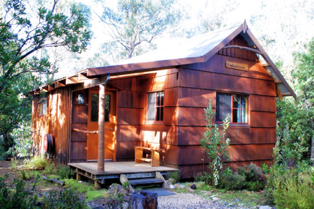  Cosy and secluded double cabin accommodation hidden away in a Cradle Mountain wilderness setting at Cradle Mountain Highlanders Cottages in Tasmania Australia. 