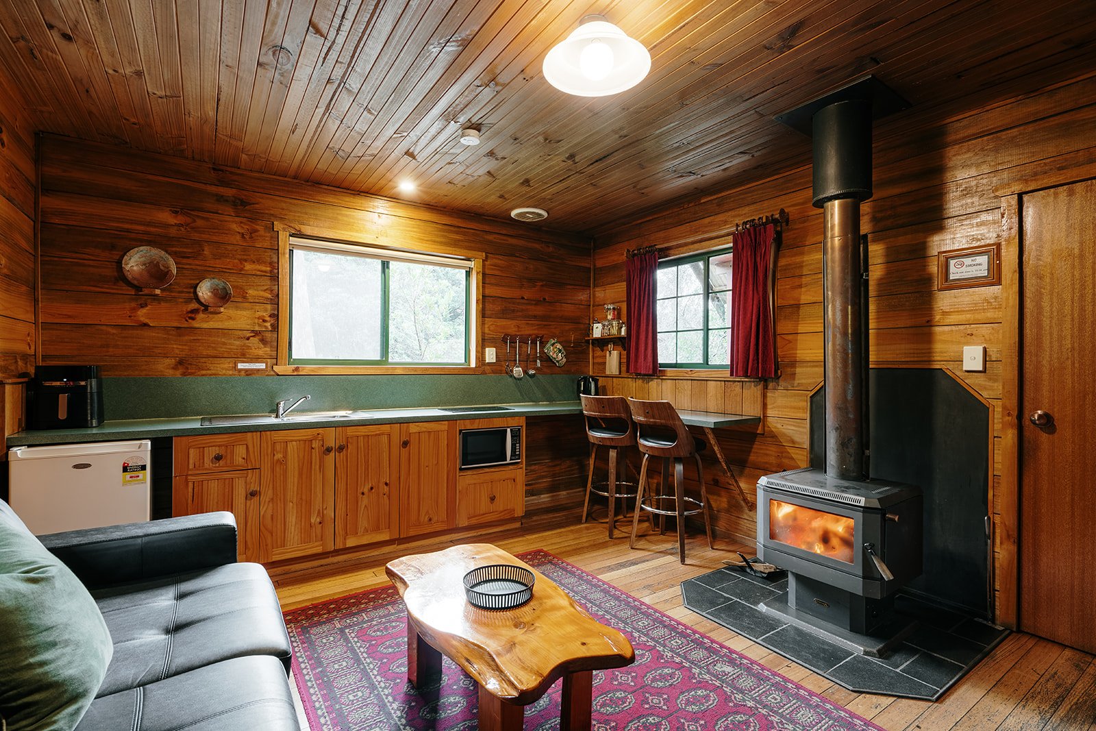 couch living fireplace and kitchen.jpg