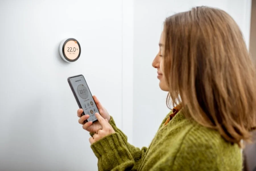 Adjusting a smart thermostat using a mobile device.jpg