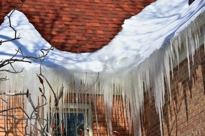 ice dam at edge of roof.