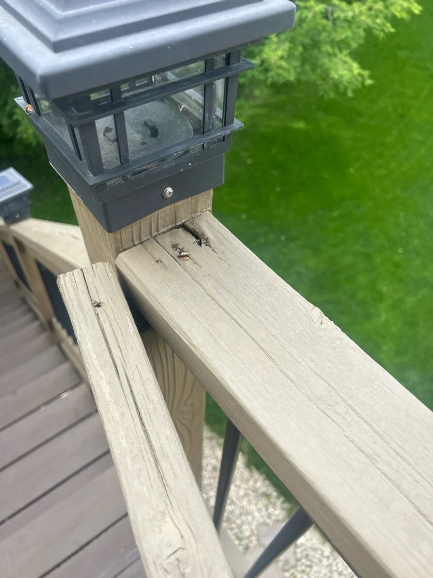 Deteriorated wood at the deck railing