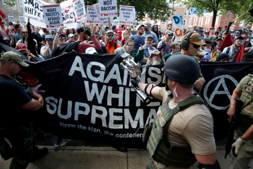4Members of white nationalists are met by a group of counter-protesters in Charlottesville, Virginia, Aug. 12, 2017. Joshua Roberts / Reuters